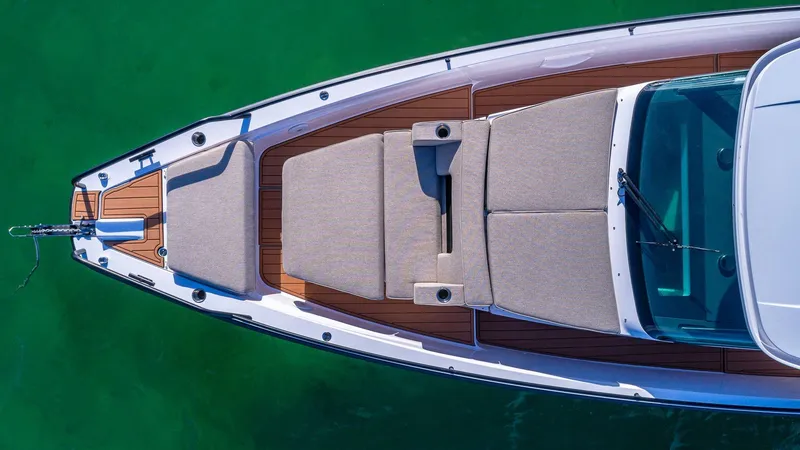 Slide: The Image of Top view of 2023 Axopar 37 Sun-Top boat with sunbathing area. - 9