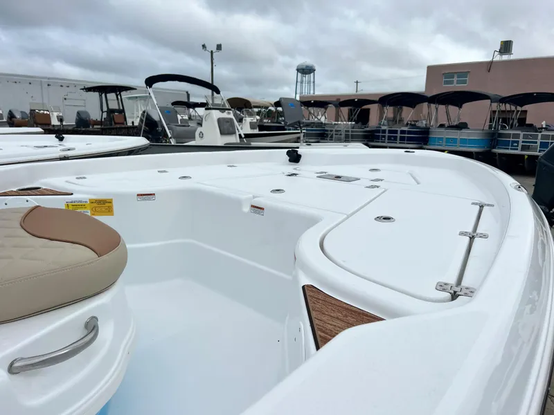 Slide: The Image of 2024 NauticStar 194 Bay boat interior at a marina. - 4