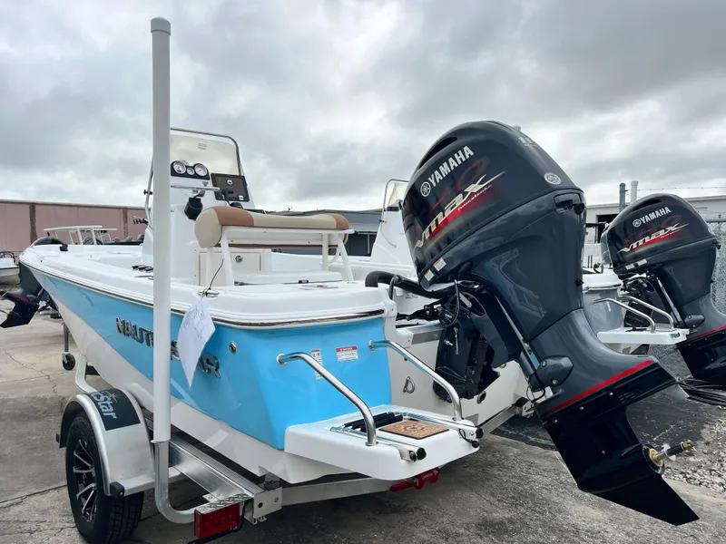 Slide: The Image of 2024 NauticStar 194 Bay boat with Yamaha outboard motor on trailer. - 5