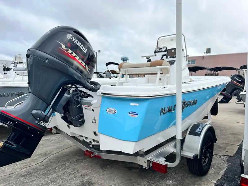 Slide: The Image of 2024 NauticStar 194 Bay boat with Yamaha outboard motor. - 6