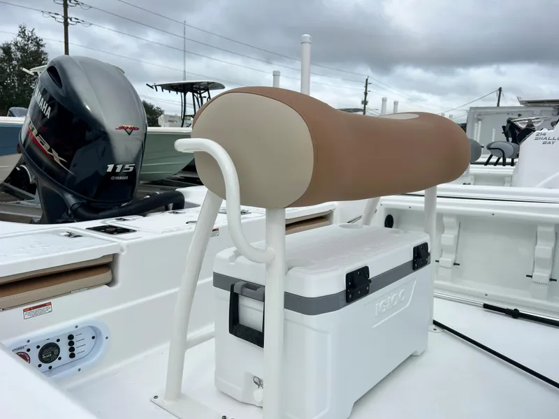 Slide: The Image of 2024 NauticStar 194 Bay boat with Yamaha 115 engine and Igloo cooler. - 9