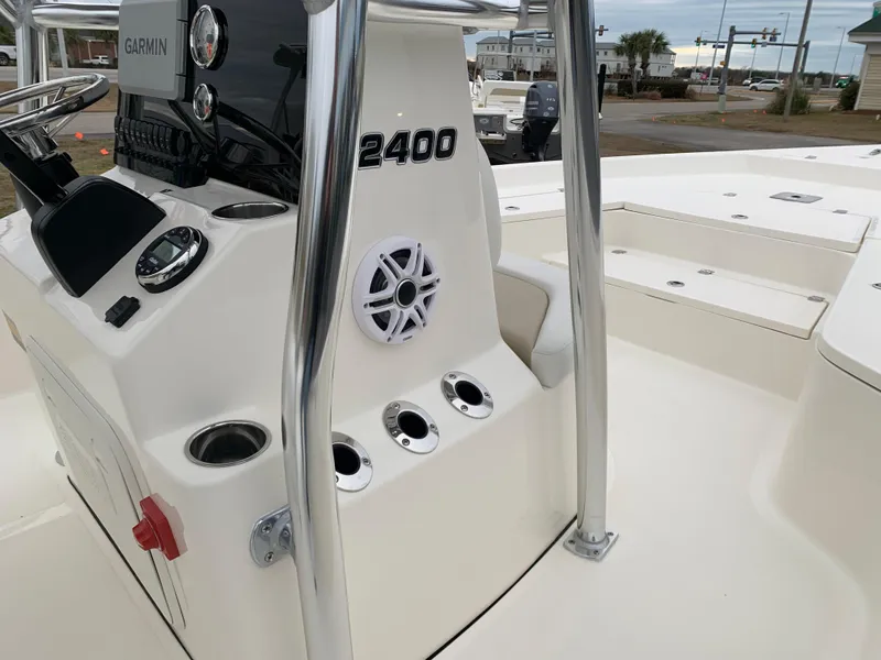 Slide: The Image of Bulls Bay 2400 boat console, featuring Garmin electronics and cup holders, 2025 model. - 20
