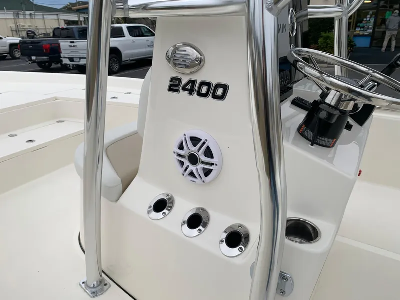 Slide: The Image of 2025 Bulls Bay 2400 boat console with steering wheel and speaker. - 21