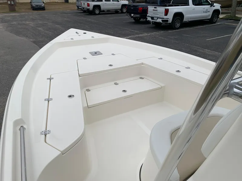 Slide: The Image of 2025 Bulls Bay 2400 boat interior with seating and storage compartments. - 22