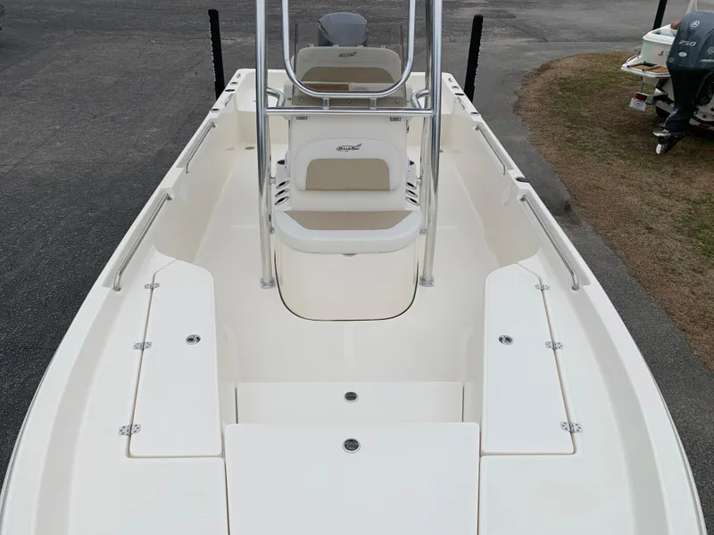 Slide: The Image of 2025 Bulls Bay 2400 boat interior with seating and storage compartments. - 28