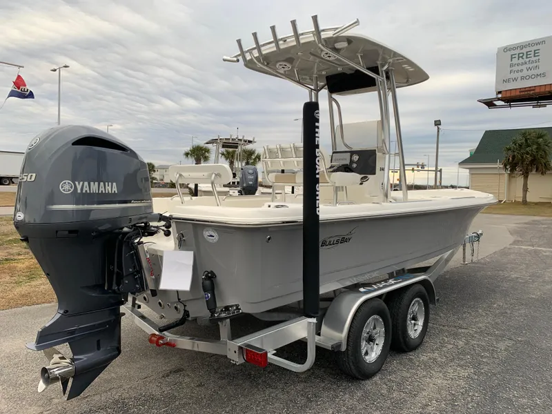 Slide: The Image of 2025 Bulls Bay 2400 boat with Yamaha engine on trailer, parked outdoors. - 4