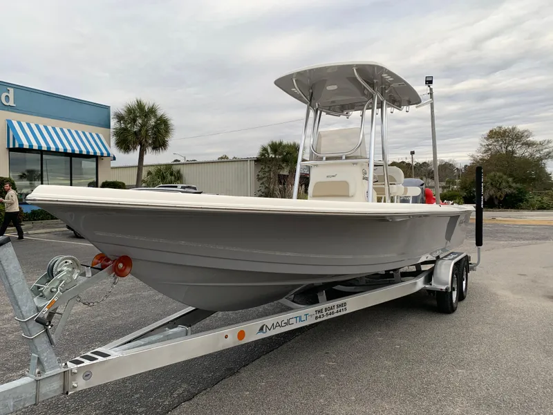 Slide: The Image of 2025 Bulls Bay 2400 boat on trailer, parked outdoors near a building. - 8