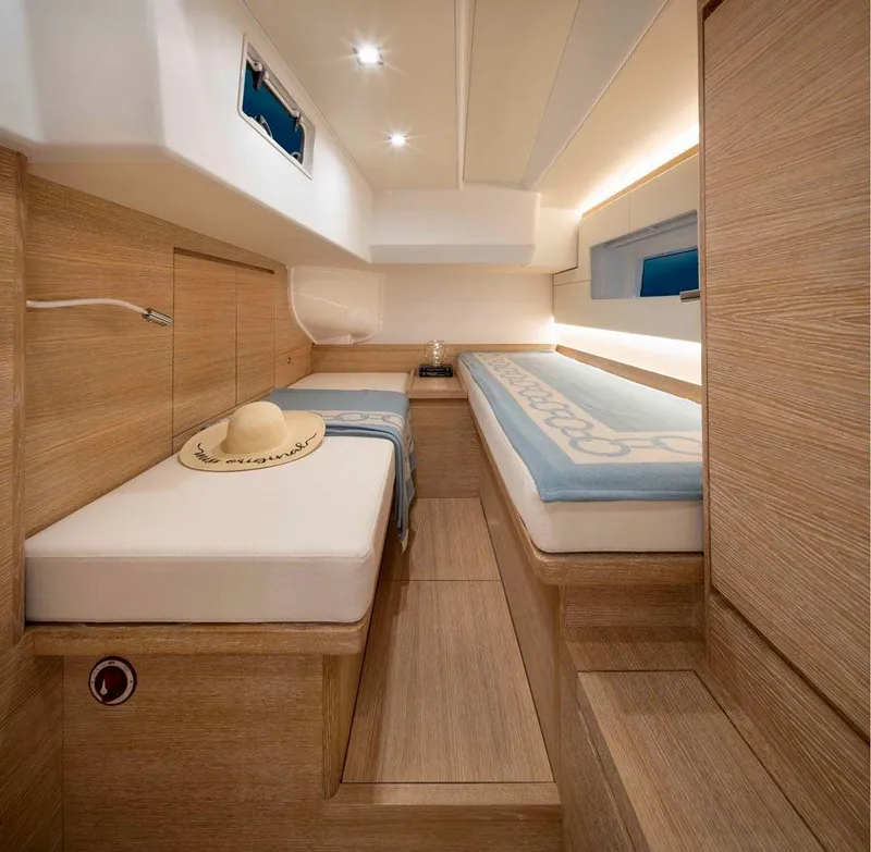 Slide: The Image of Luxurious interior of 2025 Solaris 50 yacht with wooden finishes and cozy bedding. - 11
