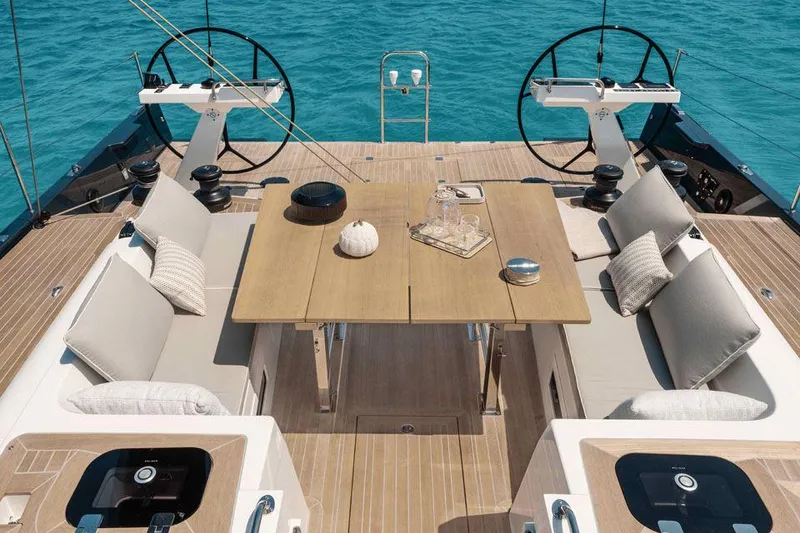 Slide: The Image of Luxurious Solaris 50 yacht deck with elegant seating and dining area, 2025 model. - 4
