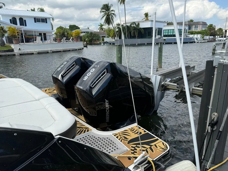 Slide: The Image of 2021 Sea Ray 400 SLX OB with twin Mercury 400 outboard engines docked. - 3