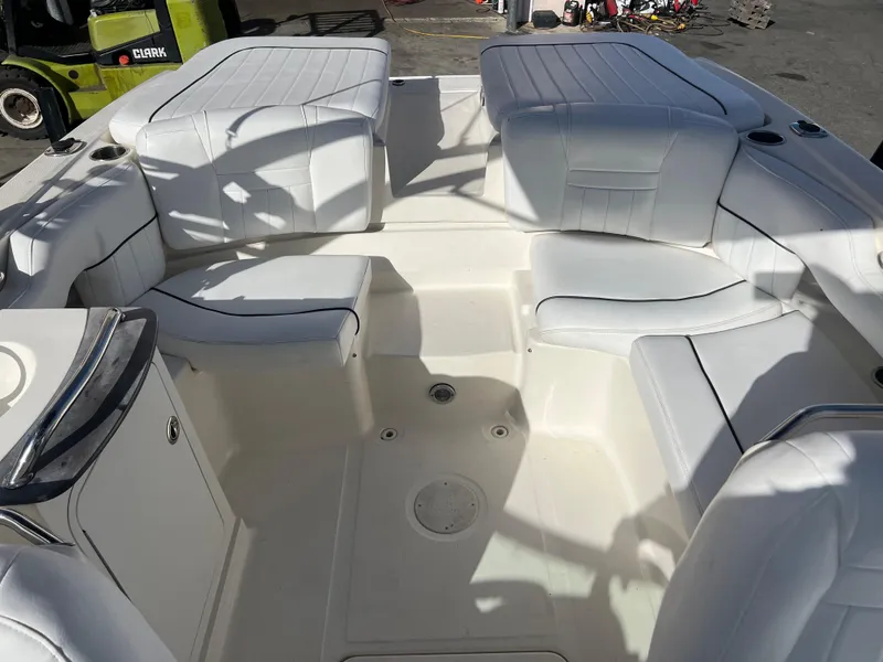 Slide: The Image of 2007 Sea Ray 250 SLX boat interior with white leather seating. - 13