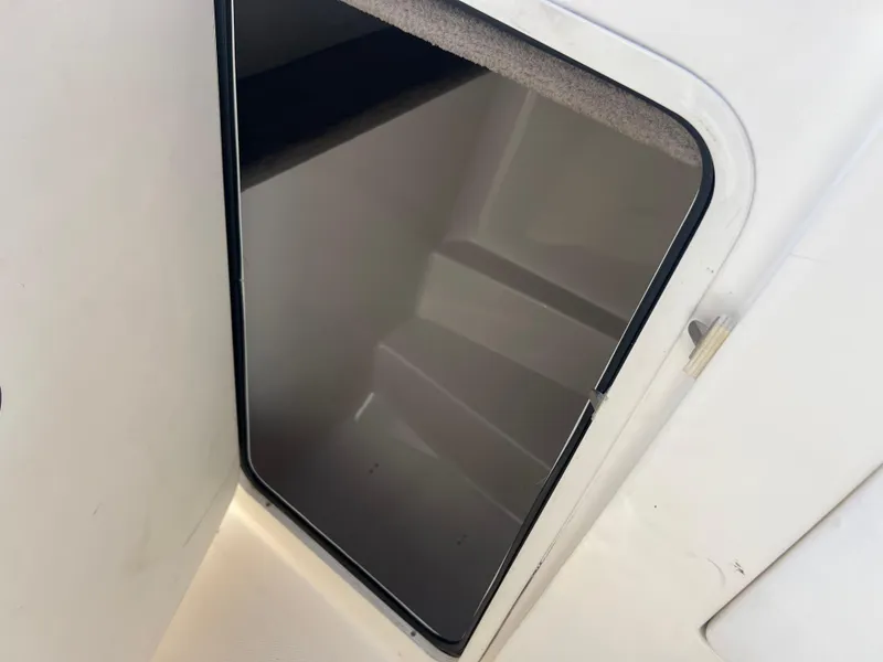 Slide: The Image of 2007 Sea Ray 250 SLX boat storage compartment. - 16