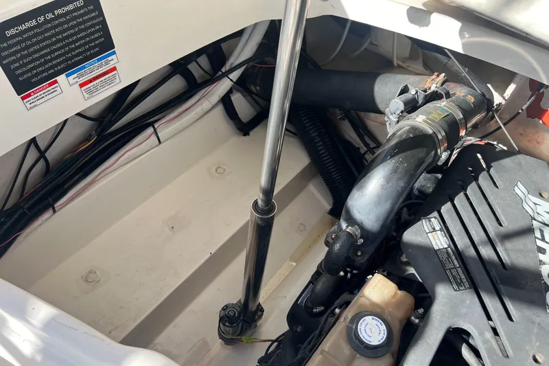 Slide: The Image of Engine compartment of a 2007 Sea Ray 250 SLX boat showing mechanical components. - 19