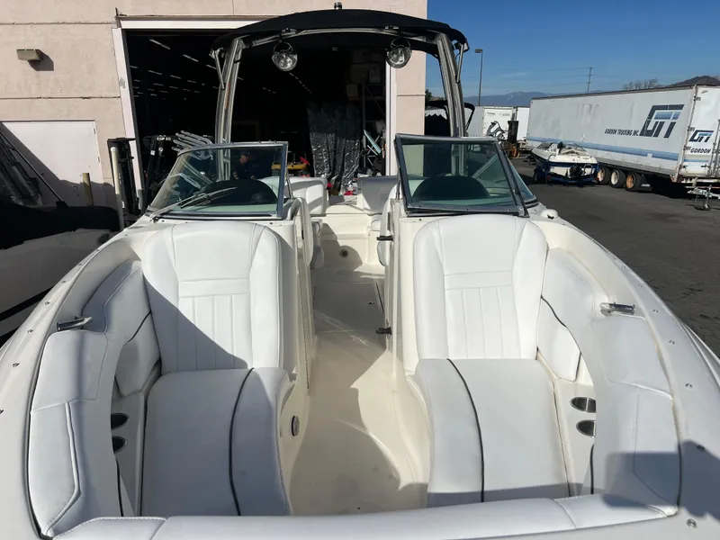 Slide: The Image of 2007 Sea Ray 250 SLX boat with white leather seats and open deck. - 4
