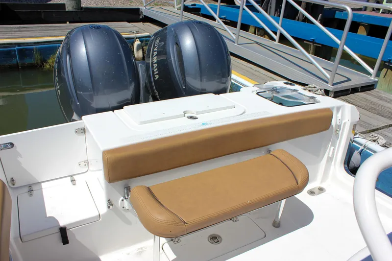 Slide: The Image of 2020 Sea Hunt Gamefish 25 boat with twin Yamaha engines and tan seating. - 11