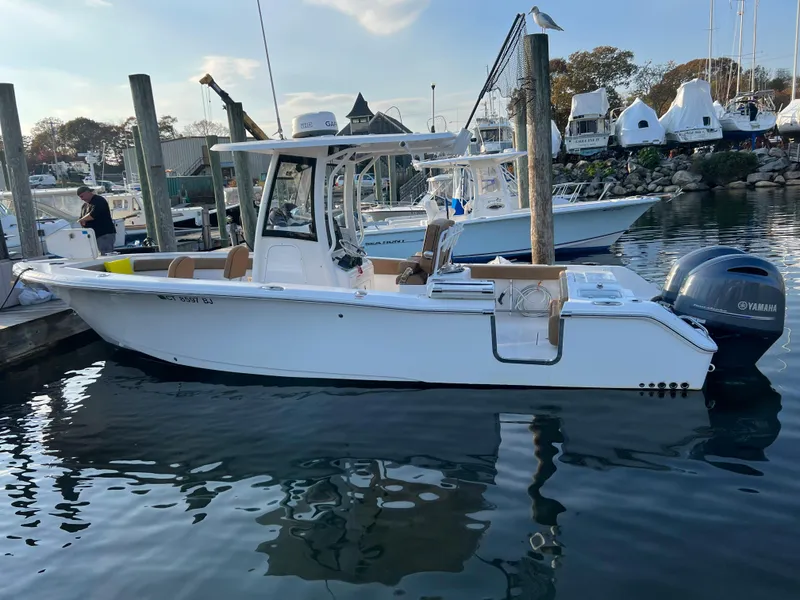 Slide: The Image of 2020 Sea Hunt Gamefish 25 boat docked at marina with Yamaha engine. - 13