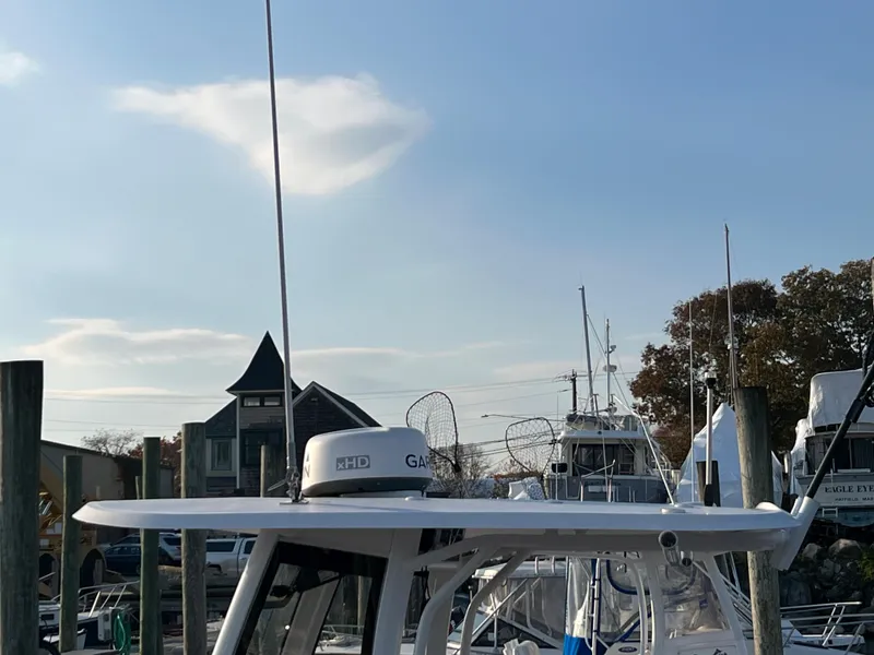 Slide: The Image of 2020 Sea Hunt Gamefish 25 boat docked at a marina. - 14