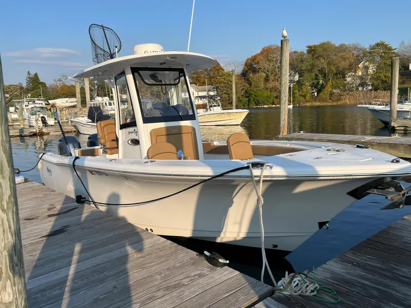 Slide: The Image of 2020 Sea Hunt Gamefish 25 boat docked at a marina. - 17