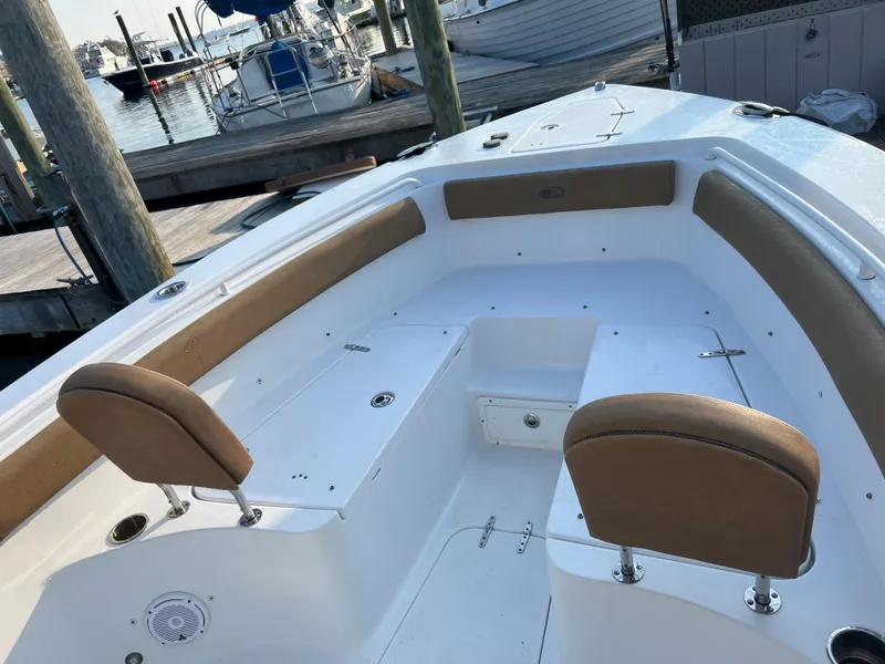 Slide: The Image of 2020 Sea Hunt Gamefish 25 boat interior with seating and storage compartments. - 20