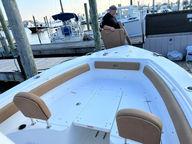Slide: The Image of 2020 Sea Hunt Gamefish 25 at dock, spacious seating and storage. - 21