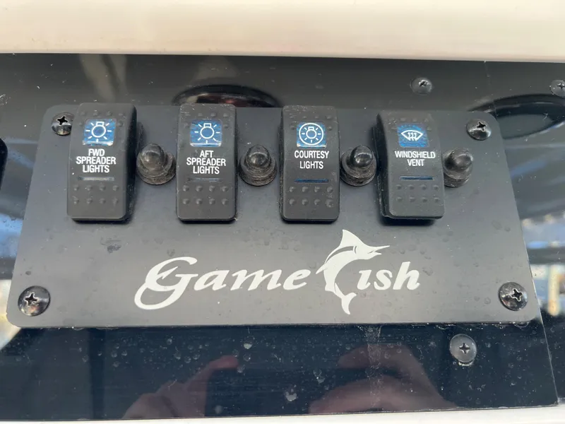 Slide: The Image of Control panel of a 2020 Sea Hunt Gamefish 25 boat. - 28