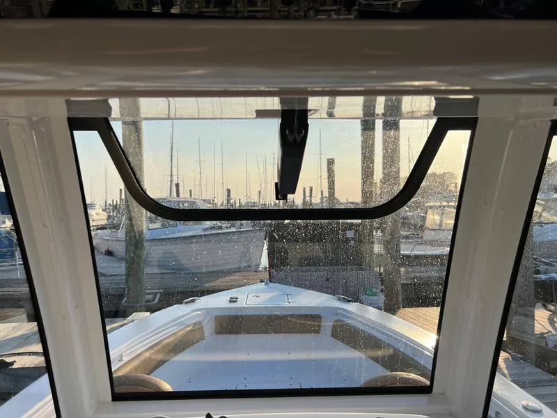Slide: The Image of View from the helm of a 2020 Sea Hunt Gamefish 25 boat at a marina. - 29