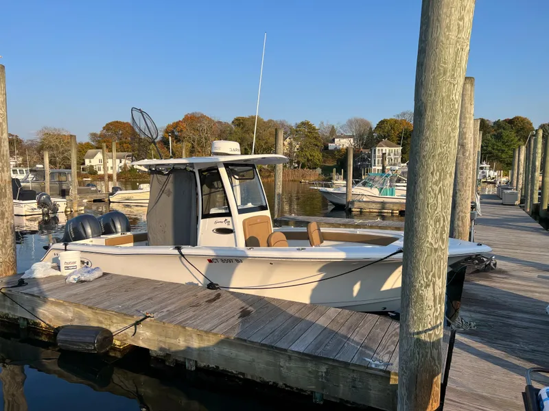 Slide: The Image of 2020 Sea Hunt Gamefish 25 boat docked at a marina. - 32