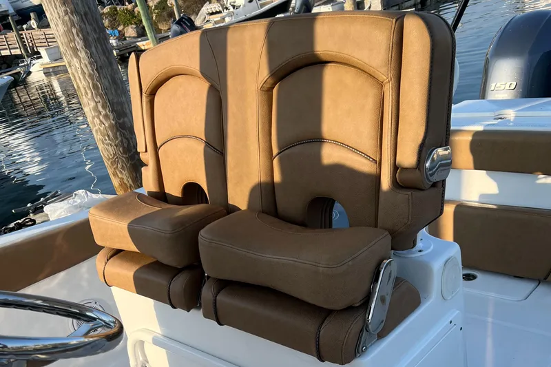 Slide: The Image of 2020 Sea Hunt Gamefish 25 boat seats, brown leather, docked at marina. - 39