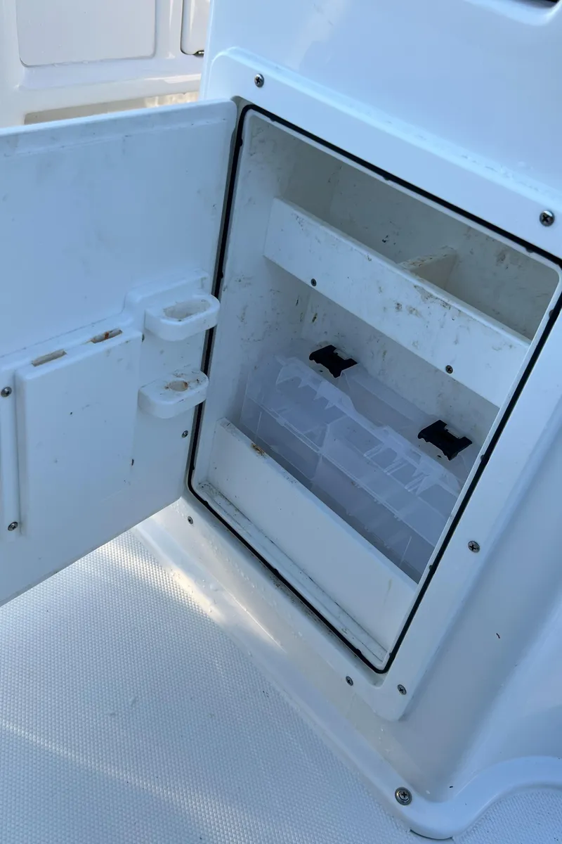 Slide: The Image of Open storage compartment on a 2020 Sea Hunt Gamefish 25 boat. - 43