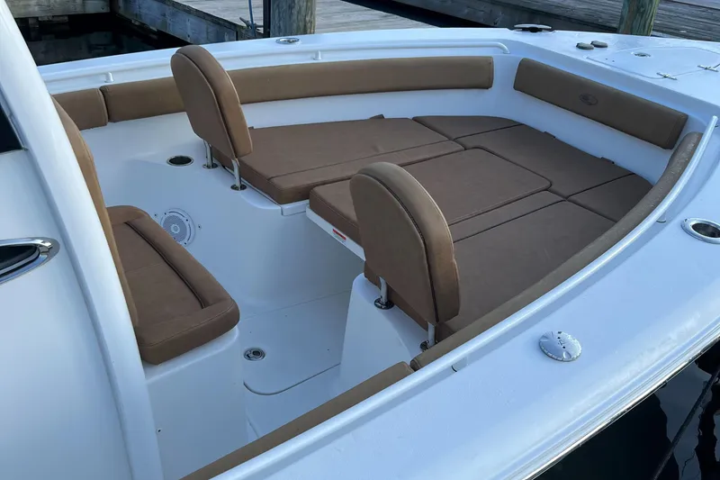 Slide: The Image of 2020 Sea Hunt Gamefish 25 boat interior with brown cushioned seating. - 45