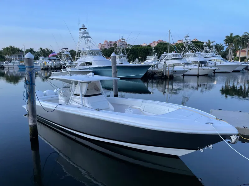 Slide: The Image of 2016 Intrepid 375 Center Console boat docked in a marina. - 15