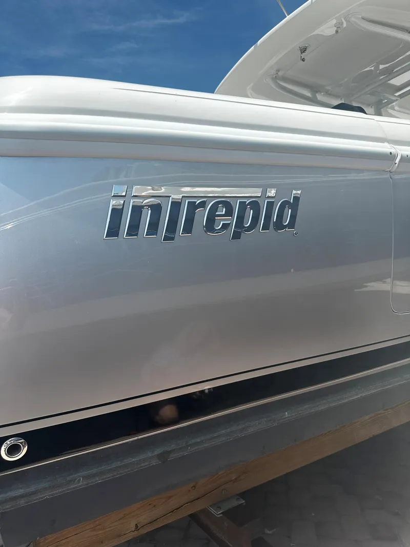 Slide: The Image of 2016 Intrepid 375 Center Console boat side view. - 18