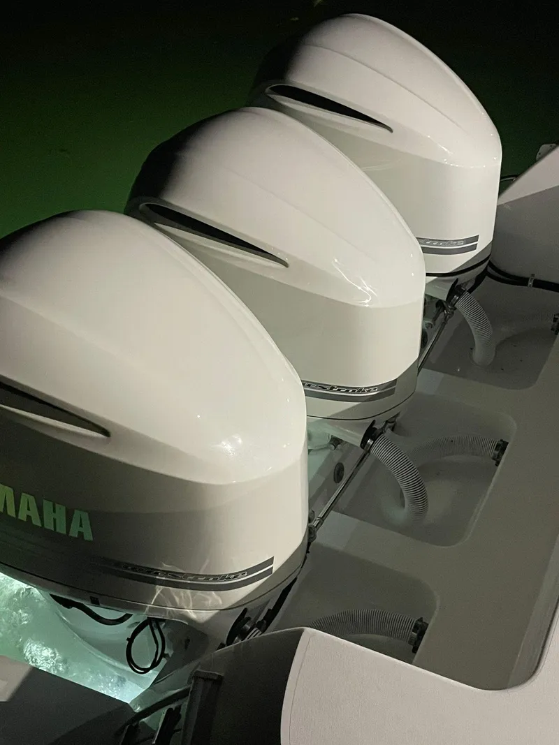 Slide: The Image of Triple Yamaha outboard engines on a 2016 Intrepid 375 Center Console boat. - 20