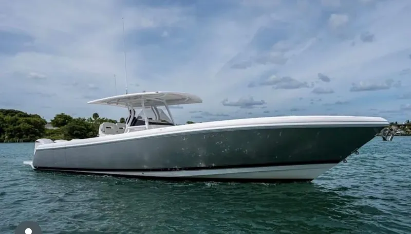 Slide: The Image of 2016 Intrepid 375 Center Console boat on water under cloudy sky. - 4