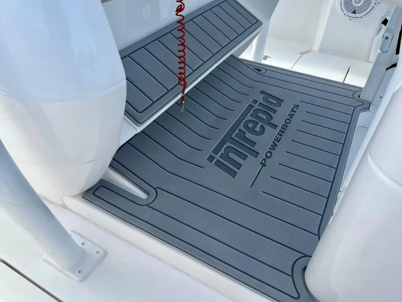 Slide: The Image of 2016 Intrepid 375 Center Console boat deck with branded mat. - 8
