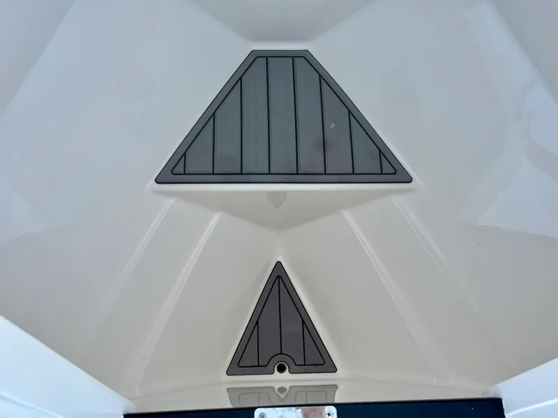 Slide: The Image of 2016 Intrepid 375 Center Console bow storage compartments. - 9