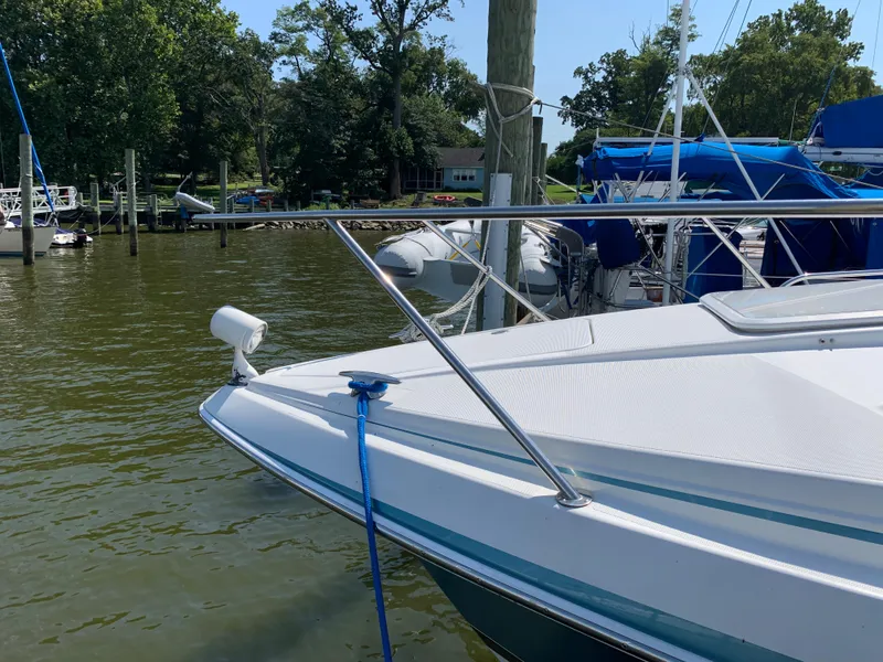 Slide: The Image of 2005 Formula 34 PC boat docked at a marina on a sunny day. - 10