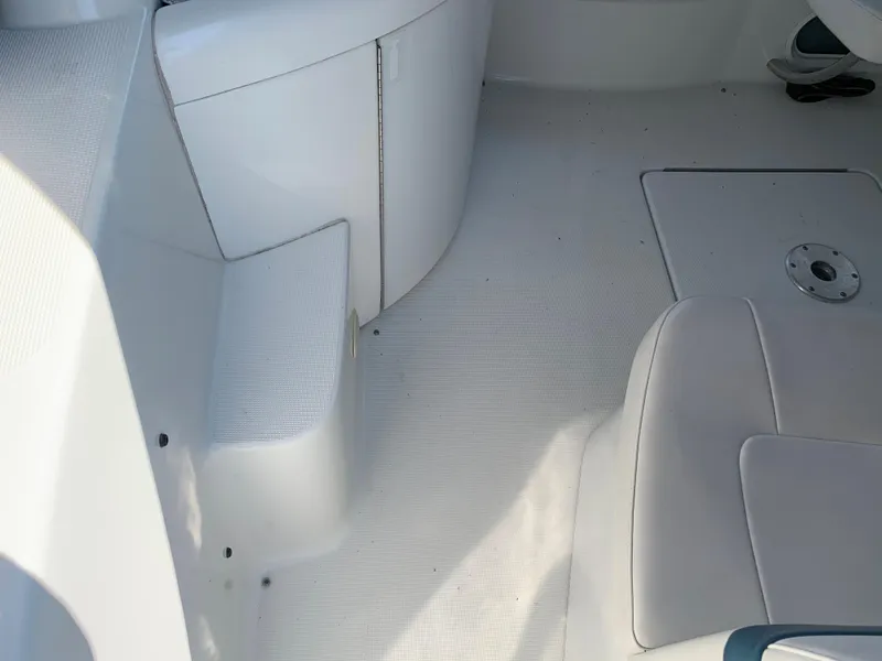 Slide: The Image of Interior of a 2005 Formula 34 PC boat showing seating and storage areas. - 14