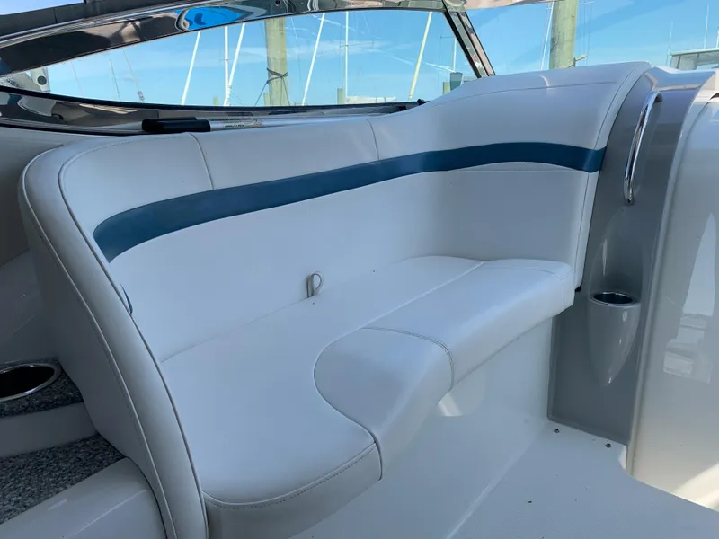Slide: The Image of 2005 Formula 34 PC boat interior seating with white and blue upholstery. - 15