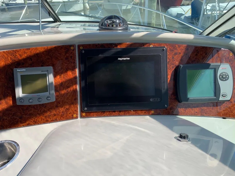 Slide: The Image of Dashboard of a 2005 Formula 34 PC boat with navigation and control systems. - 17