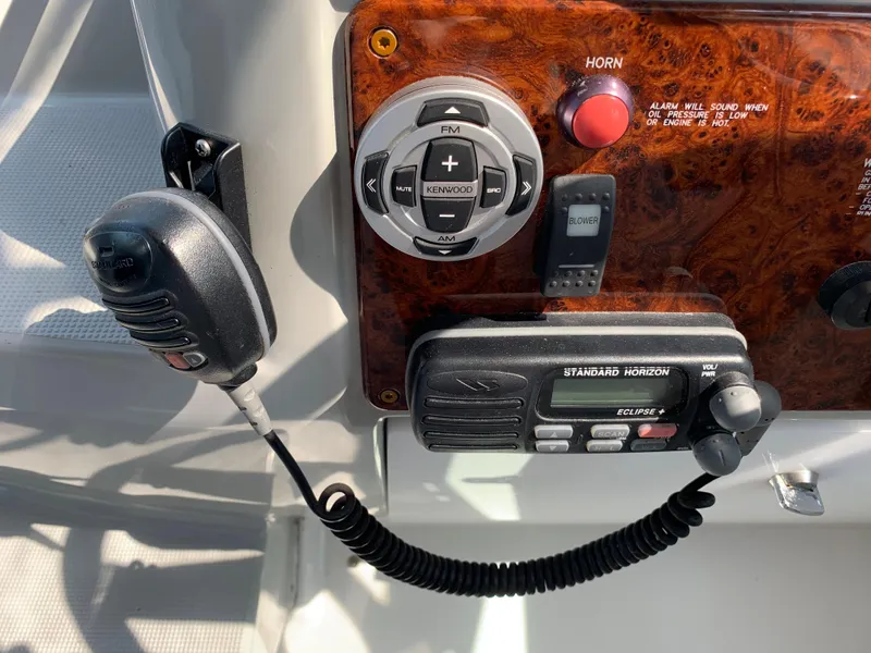 Slide: The Image of Control panel of a 2005 Formula 34 Performance Cruiser with radio and microphone. - 19