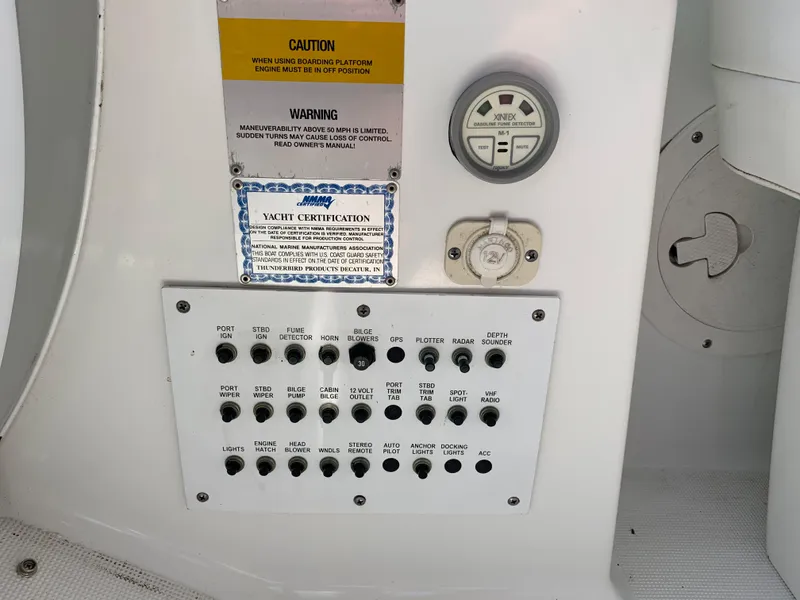Slide: The Image of Control panel of a 2005 Formula 34 Performance Cruiser with switches and gauges. - 21