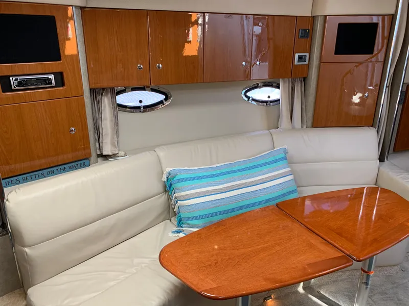 Slide: The Image of Interior of 2005 Formula 34 Performance Cruiser with leather seating and wooden cabinetry. - 26