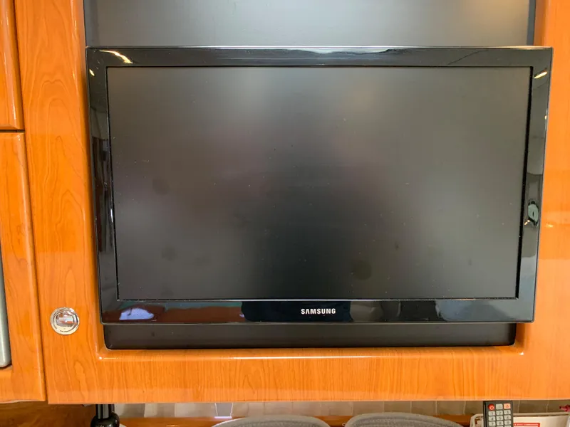Slide: The Image of Samsung TV mounted on a 2005 Formula 34 Performance Cruiser's wooden interior. - 27