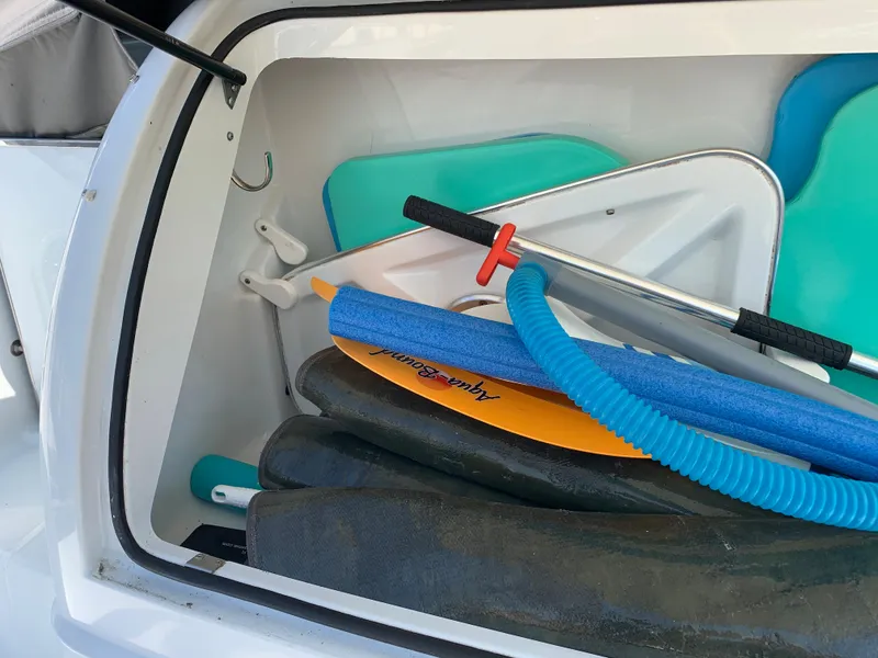 Slide: The Image of Storage compartment of a 2005 Formula 34 PC boat with water sports equipment. - 3