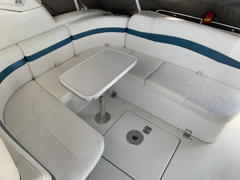 Slide: The Image of 2005 Formula 34 Performance Cruiser boat on stands, blue hull, docked outdoors. - 47