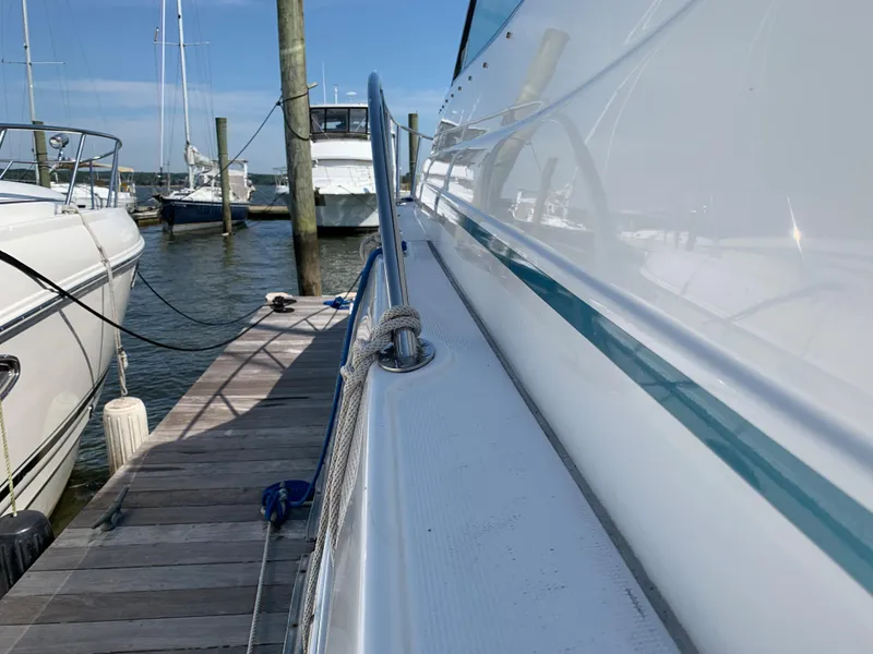 Slide: The Image of 2005 Formula 34 PC yacht docked at a marina on a sunny day. - 6