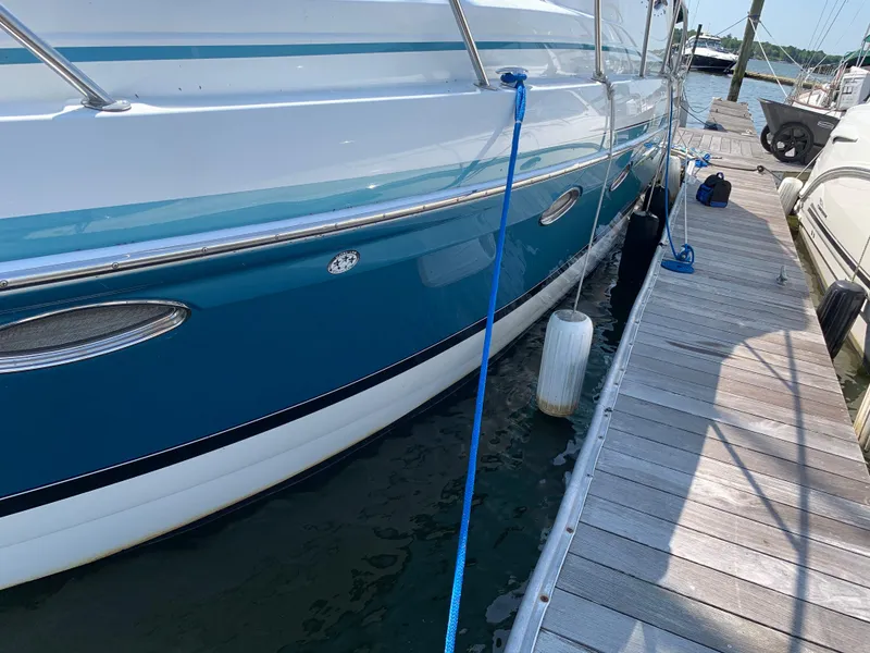 Slide: The Image of 2005 Formula 34 PC boat docked at a marina. - 8