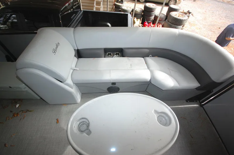 Slide: The Image of 2021 Bentley Pontoons 243 Swingback interior seating and table. - 12