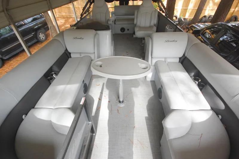 Slide: The Image of 2021 Bentley Pontoons 243 Swingback interior with spacious seating and table. - 7